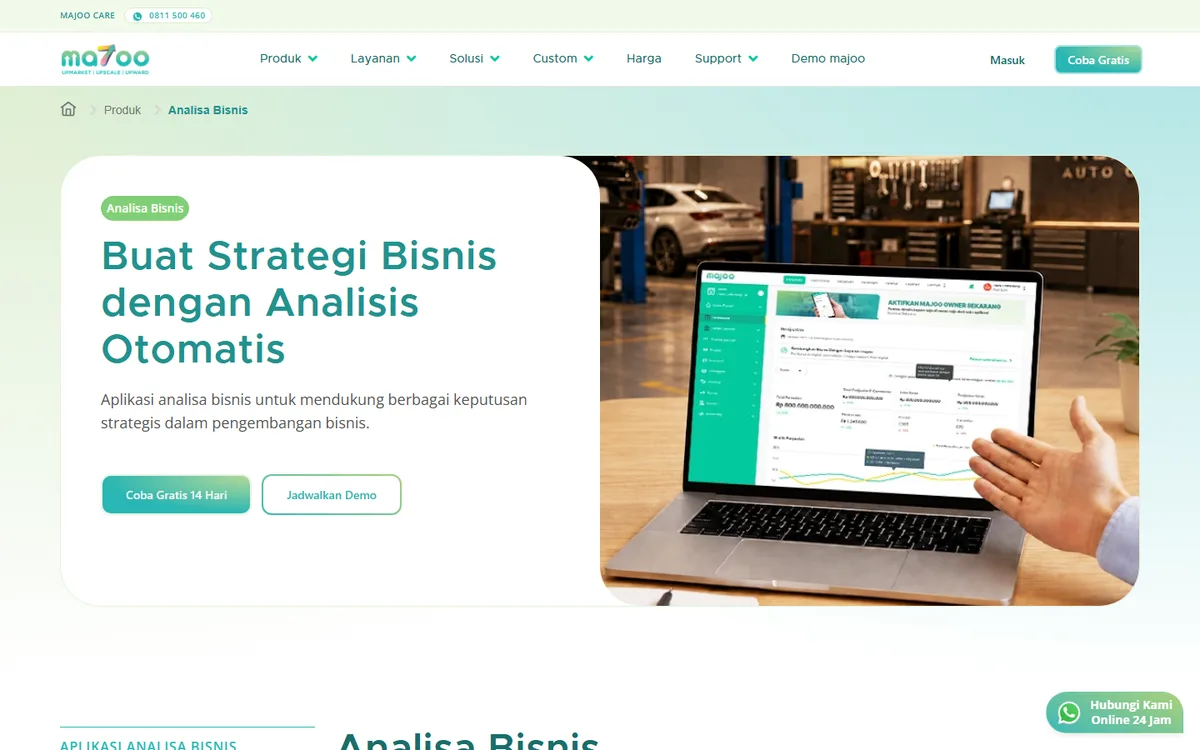 Screenshot halaman produk Analisa Bisnis majoo yang menampilkan dashboard aplikasi di layar laptop beserta tombol Coba Gratis 14 Hari dan Jadwalkan Demo